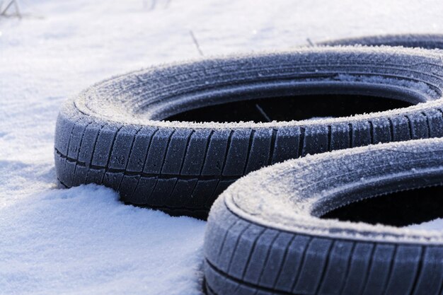 Winter tires on snow on sunny winter freezing day