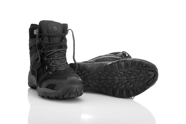 Winter trekking boots isolated on white background