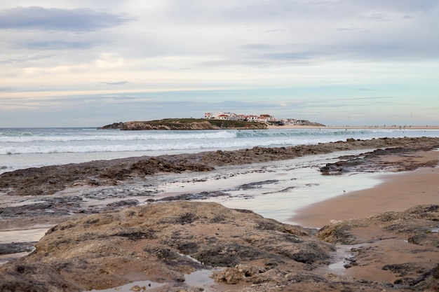 Winter view on ocean and island Baleal, Portugal