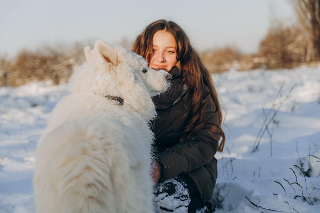 Winter walk with your favorite Samoyed pet