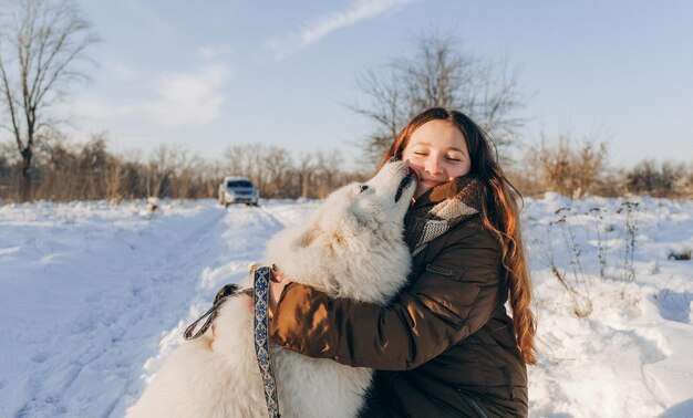 Winter walk with your favorite Samoyed pet