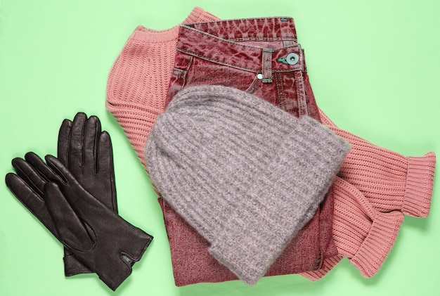 Winter woolen hat, sweater, leather gloves, jeans