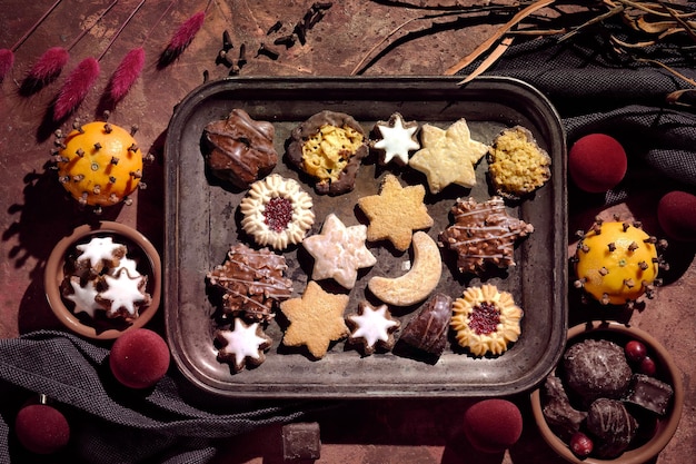 Wintertime sweets  gingerbread  star linzer and butter cookies assorted cookies on metal tray