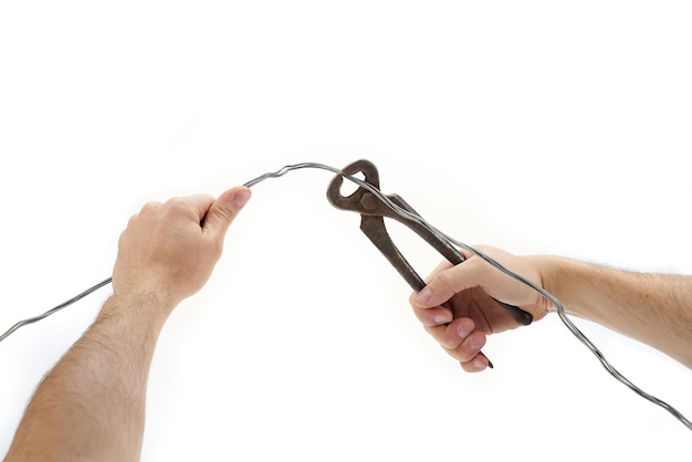 Wire cutter cutting a piece of wire isolated on white