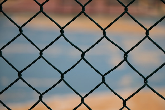 Wire mesh fence colosed up iron steel with color background