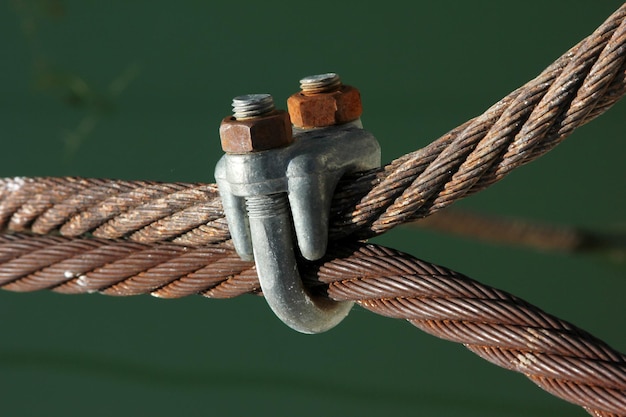 Wire rope clamps and rusty steel ropes