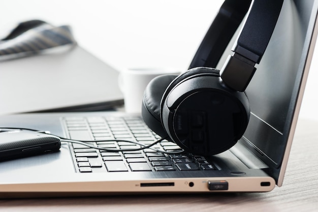 Wired black headphone isolated on the desktop