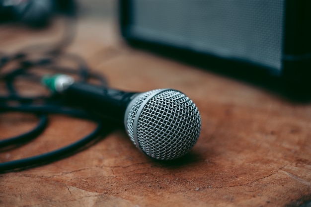 Wired microphone for vocals on a wooden table