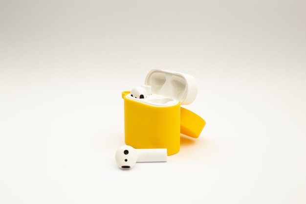 Wireless headphones in a bright yellow case