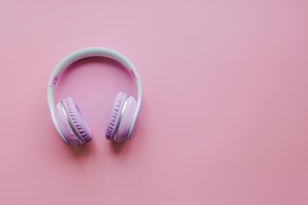 Wireless headphones on pink background