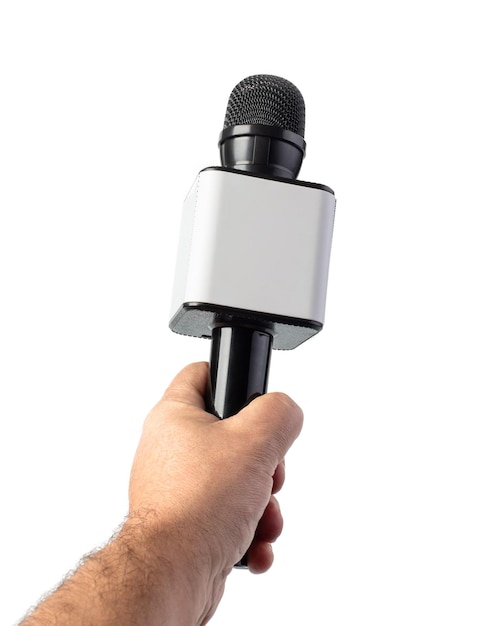 Wireless microphone in hand isolated on white