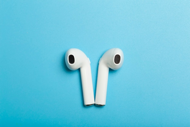 Wireless sound audio headphones on a colored background music app listening