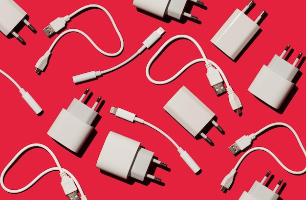 Photo wires on a red background chargers and adapters