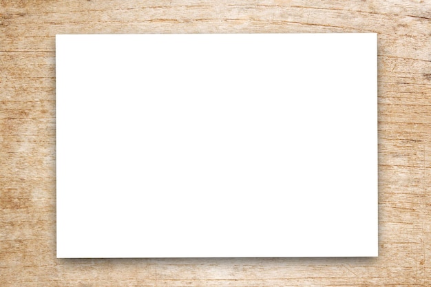 Foto wit blanco papier of notitieblok op houten tafel