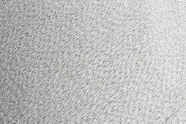 Wit getinte abstracte textiel textuur achtergrond