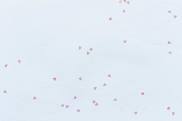 Wit papier versierd met kleine harten getextureerde achtergrond