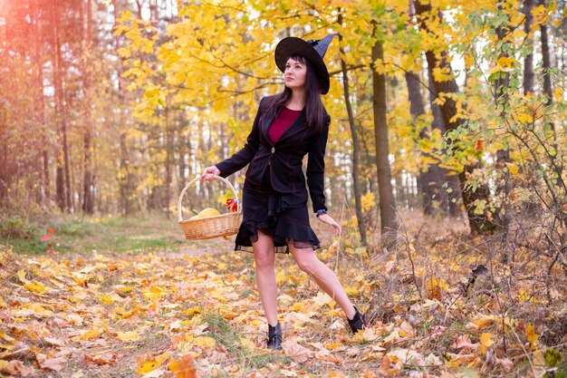 Witch in the autumn forest halloween cosplay halloween fall holiday celebration