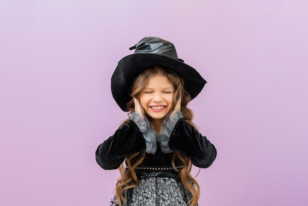 The witch covered her ears with her hands Fancy dress for Halloween