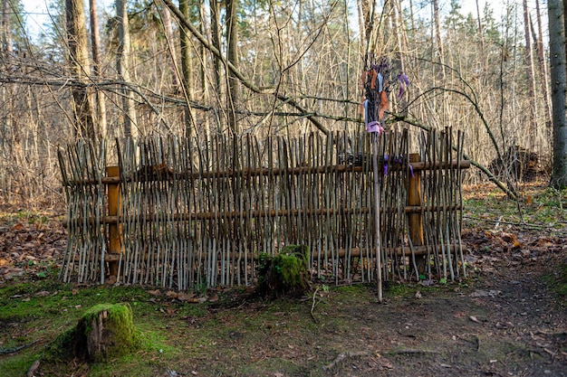 A witchs broom by a branch fence in a fairytale magical forest