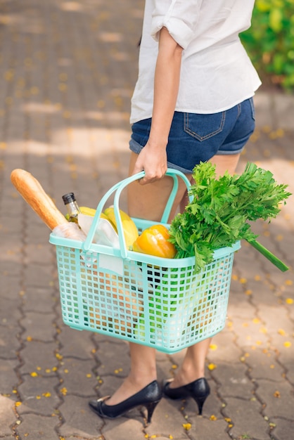 With shopping basket 