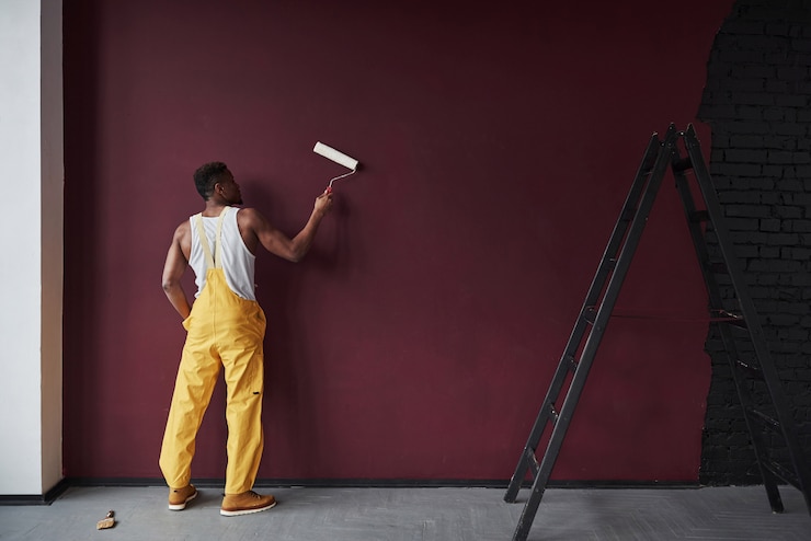 Photo with white platen in hands. young african american worker in the yellow uniform have some job