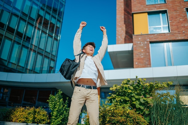 With a winning smile and an infectious spirit an asian korean student boy celebrates his success