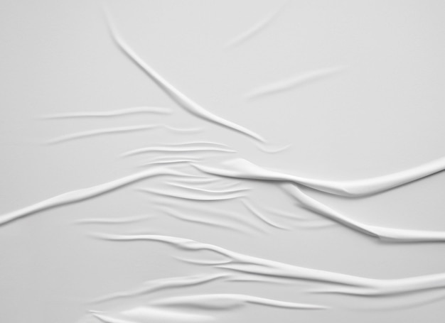 Witte blanco verfrommeld en gevouwen papier poster textuur achtergrond