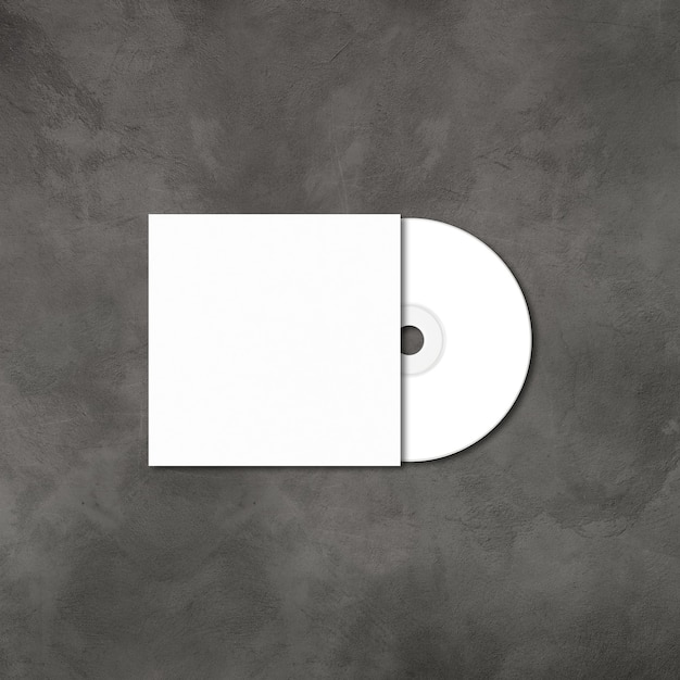 Foto witte cd - dvd-label en omslagmodel sjabloon geïsoleerd op concrete achtergrond