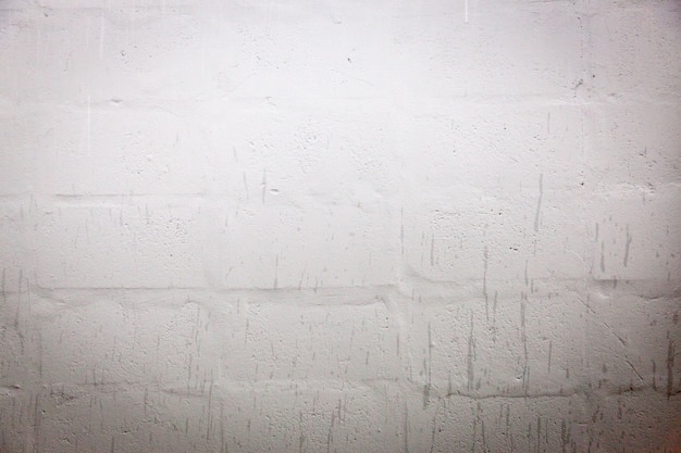 Witte de muurachtergrond en textuur van het sintelbloemblok