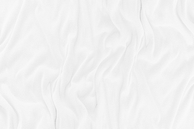 Witte doek textuur met zachte golven. verfrommeld stof achtergrond.