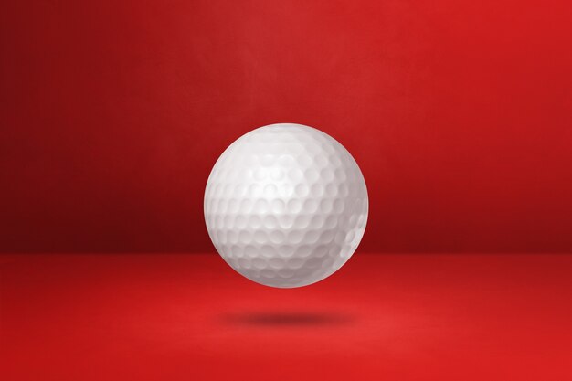 Witte golfbal op een rode achtergrond. 3D illustratie