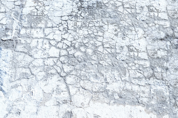 Witte grunge gebarsten de textuur abstracte achtergrond van de cementmuur