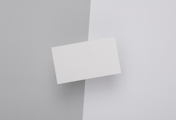 Foto witte lege visitekaartje voor branding op witte grijze achtergrond