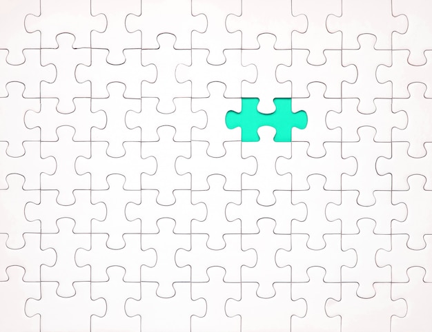 Witte puzzelstukjes op blauwe achtergrond. Achtergrond voor inhoud