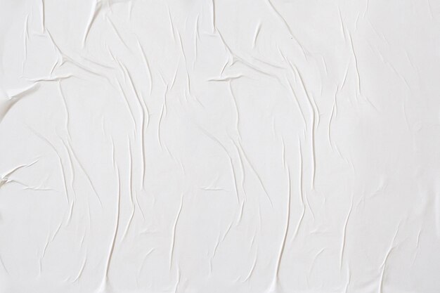 Witte verfrommeld en gevouwen papier poster textuur achtergrond