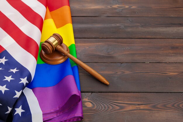 Photo woden judge mallet with lgbt flag