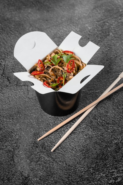 Wok in box spicy noodles in black food container