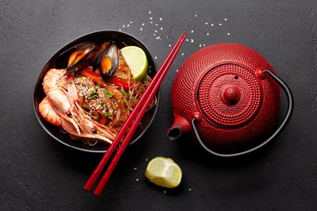 Wok with stir fried noodles shrimps and vegetables