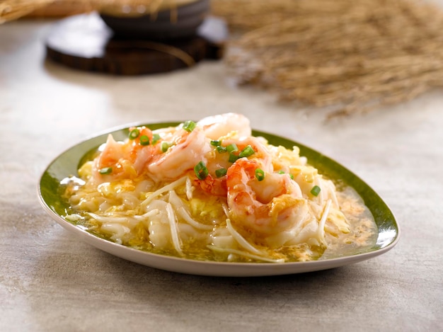 WokFried Seafood Horfun With Egg served in dish isolated on table top view of food