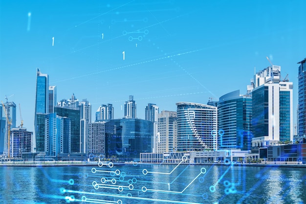 Wolkenkrabbers van het zakencentrum van Dubai Internationaal knooppunt van handel en financiële diensten Technologie thema iconen hologram Fintech concept Dubbele belichting Dubai Canal waterkant