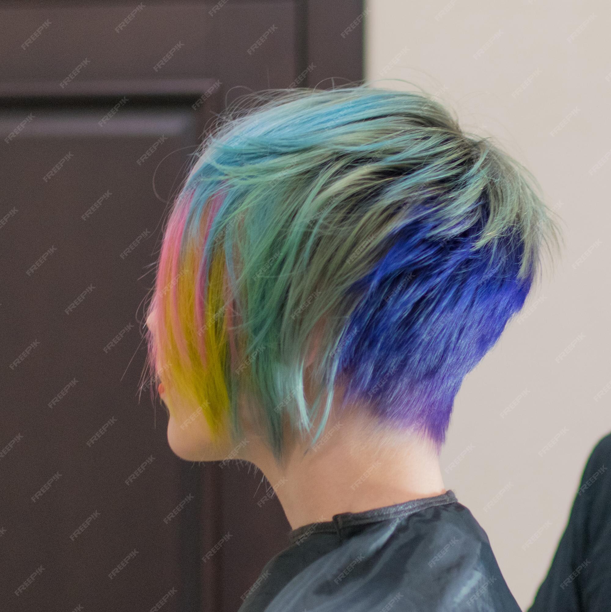 Premium Photo | Woman 3040 smiles and made coloring of hair in different colors in a hairdressing salon change the image of a woman Premium Photo | Woman 3040 smiles and made coloring of hair in different colors in a hairdressing salon change the image of a woman