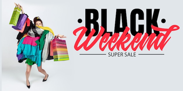 Woman addicted of sales and clothes, black weekend, sales concept