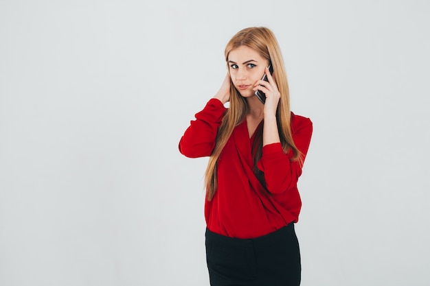 Photo woman adjusting hair and talking on phone