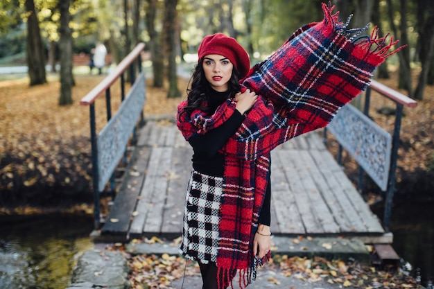 Woman adjusting scarf