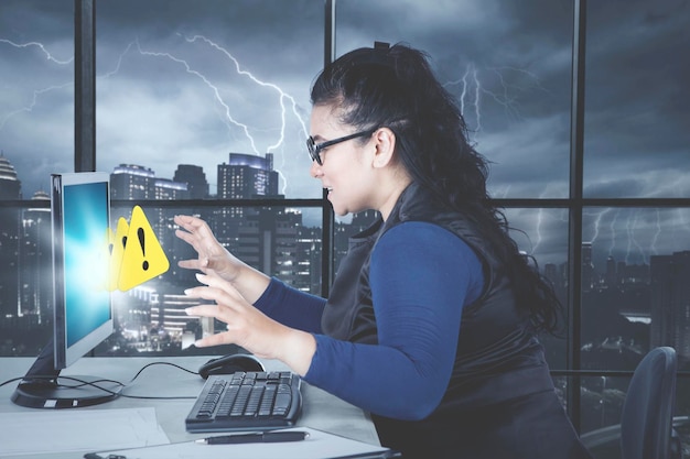 Woman annoyed at popped up sign at stormy day