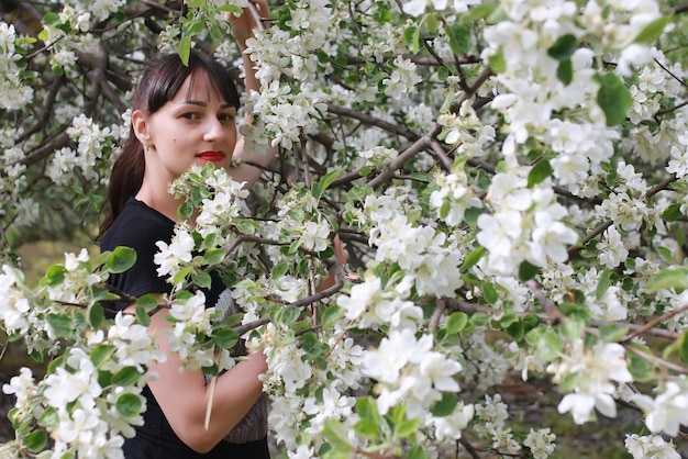 Woman in apple park tree