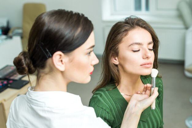 Woman applying cosmetic