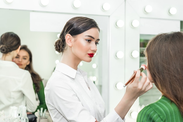 Woman applying cosmetic