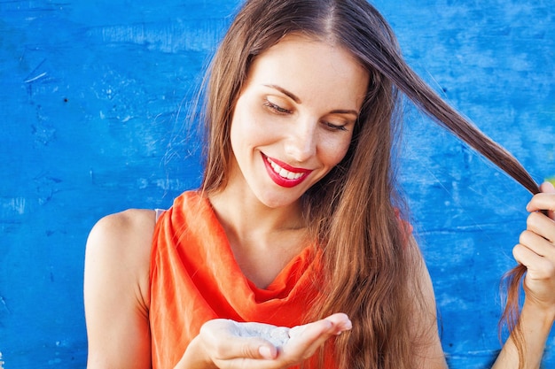 Woman applying dry shampoo