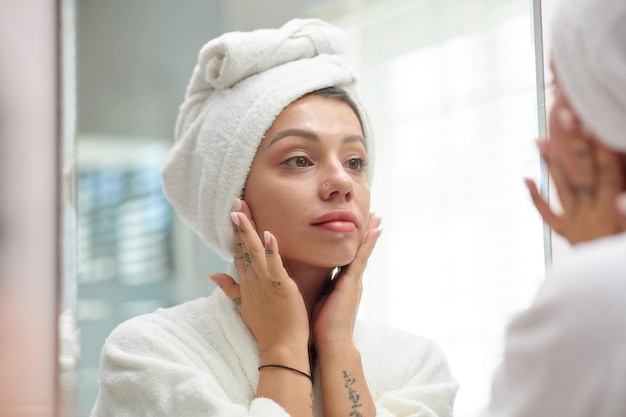 Woman applying face cream